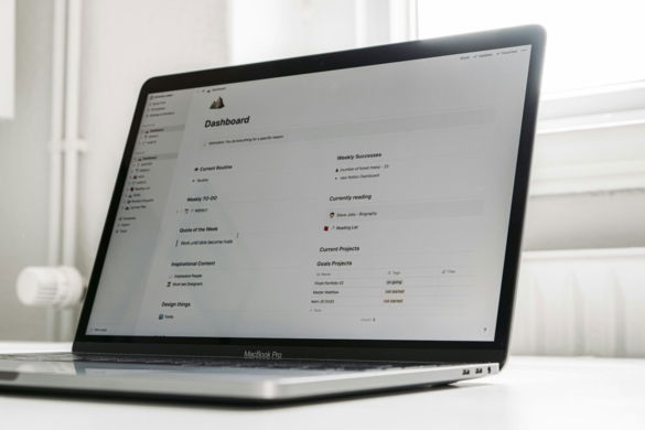 a-laptop-computer-sitting-on-top-of-a-white-table.jpg a laptop computer sitting on top of a white table